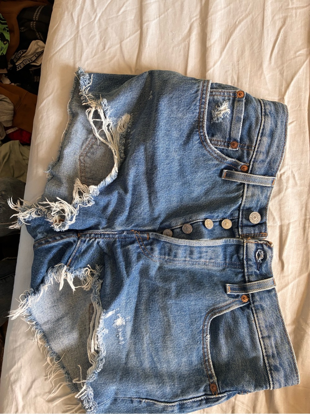 Levi's High-Rise Distressed Denim Shorts — Medium Blue